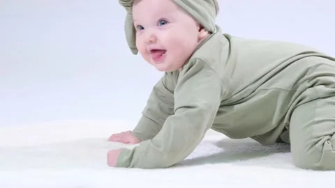 Baby learns to crawl Stock Footage 146456963
