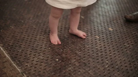 Baby learns to walk Stock Footage 45963583