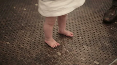 Baby learns to walk Stock Footage 45963698