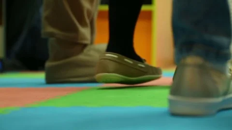 Baby leg girl in moccasins dance Stock Footage