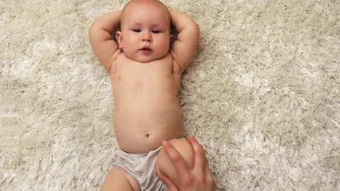 Baby legs exercise Stock Footage 93579631
