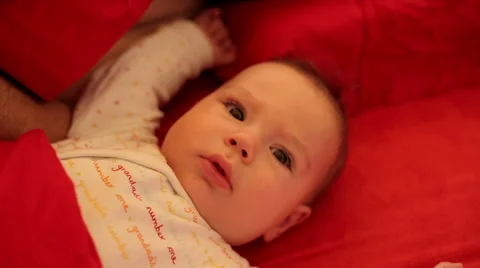 Baby look camera in bed Stock Footage 59776449