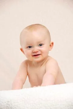Baby looking at the camera smiling Stock Photos