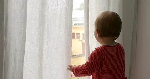 Baby looking out of window Stock Footage 111751720