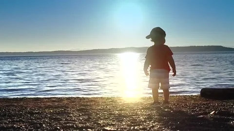 Baby is looking at the sunset. Stock Footage 64727255