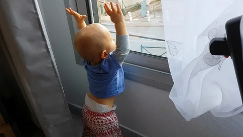 Baby Looking Through The Window Stock Footage 97452882