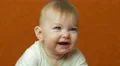 The baby looks and smile. Close-up portrait view. Shot with Red Cinema Camera 4k or 4k+ Resolution