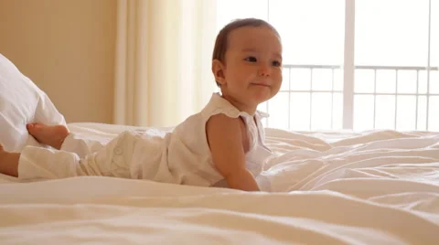 Baby lying on bed Video stock 43617333