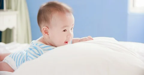 Baby lying on the bed Stock Footage 110739470