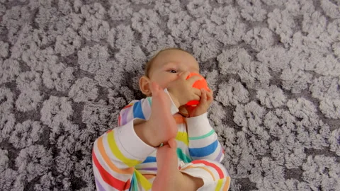 Baby is lying on the bed. Selective focus. Stock Footage 261140376