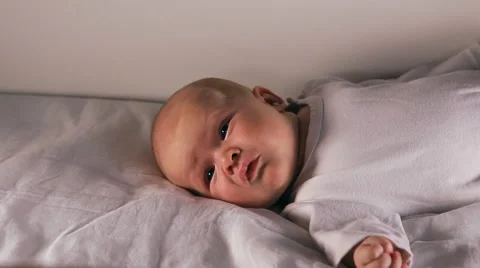 The baby is lying on a blanket Stock Footage 45845685
