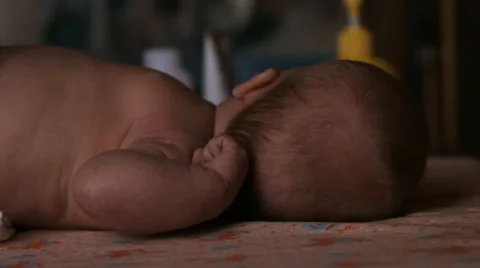 The baby is lying on a blanket Stock Footage 46061177