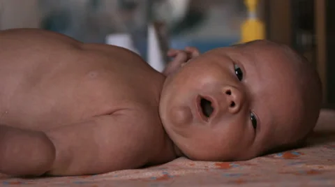 The baby is lying on a blanket Stock Footage 46061497
