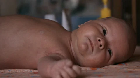The baby is lying on a blanket Stock Footage 46061567