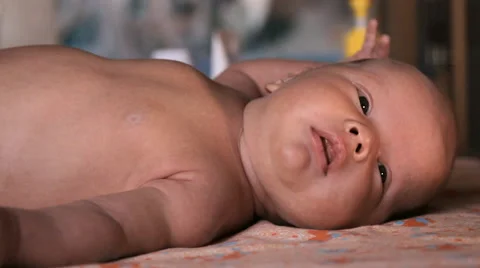 The baby is lying on a blanket Stock Footage 46061590