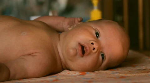 The baby is lying on a blanket Stock Footage 46061637