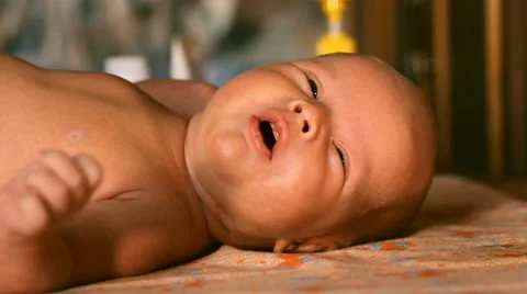 The baby is lying on a blanket Stock Footage 46061707