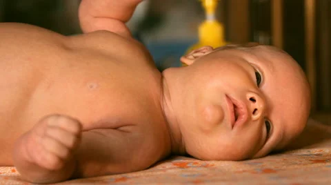 The baby is lying on a blanket Stock Footage 46062132