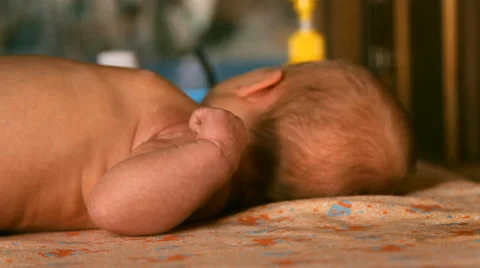 The baby is lying on a blanket Stock Footage 46062219