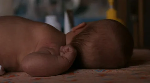 The baby is lying on a blanket Stock Footage 46063469