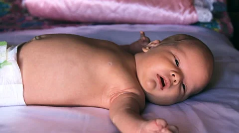 The baby is lying on a blanket Stock Footage 46203366