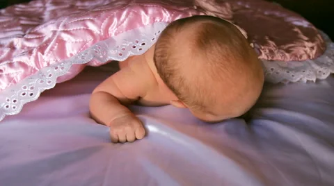 The baby is lying on a blanket Stock Footage 46726124