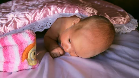 The baby is lying on a blanket Stock Footage 46726451