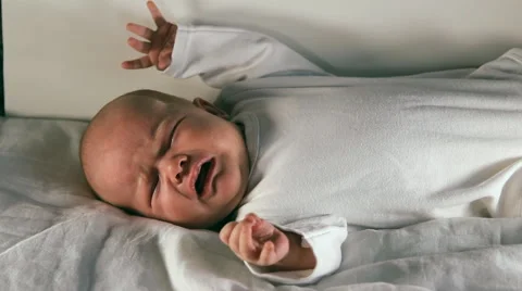 The baby is lying on a blanket Stock Footage 46908620