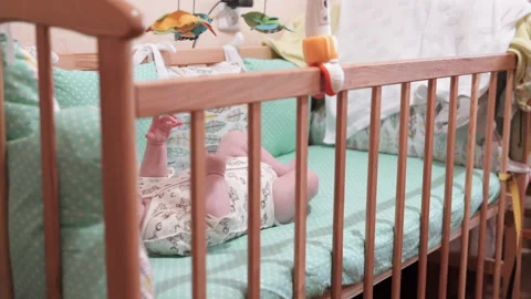 The baby is lying in its bed Stock Footage 104855234