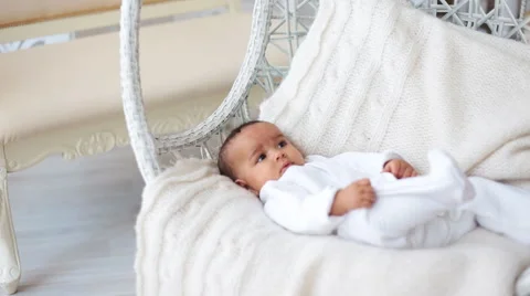 Baby lying on white sheet Stock Footage 68847086