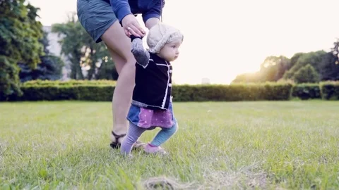 A baby is making the first steps Stock Footage 77634523