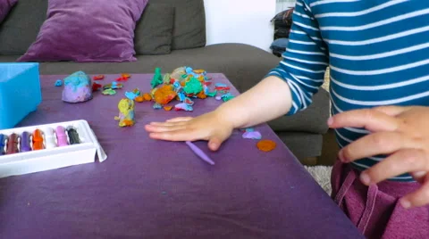 Baby modeling with plasticine Stock Footage 65094237
