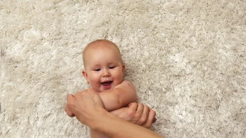 Baby with mom doing exercise Stock Footage 93598301