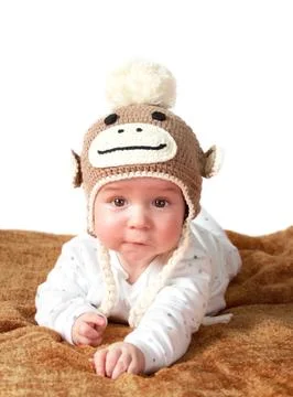 Baby in monkey hat Stock Photos