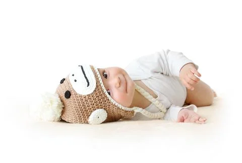 Baby in monkey hat Stock Photos