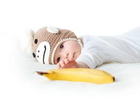 Baby in monkey hat Stock Photos