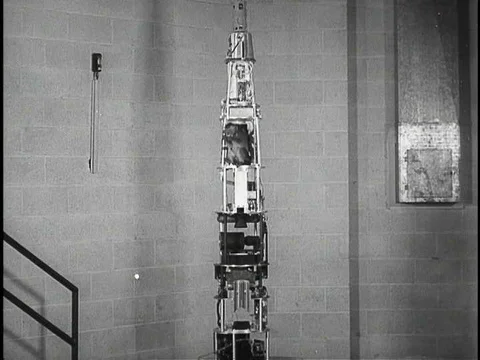 A baby monkey is strapped into a space capsule before a rocket flight test. Stock Footage 75233816