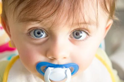 Baby with pacifier Stock Photos
