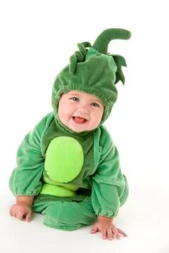 Baby in peas in pod costume smiling Stock Photos