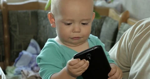 Baby phaying with smartphone Stock Footage 68060372