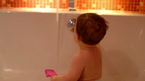 Baby is play in a bath  Stock Footage 61924874