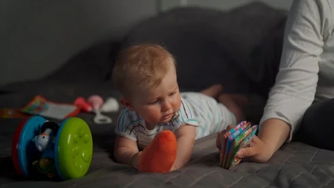Baby play in bed Stock Footage 107704470