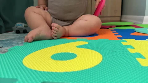 Baby on Play Mat Stock Footage 245692860