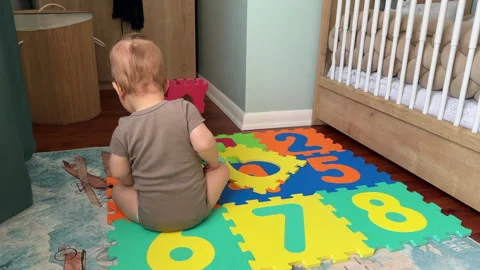 BABY ON PLAY MAT Stock Footage 245973654
