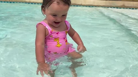 Baby play with water  Stock Footage 154336636