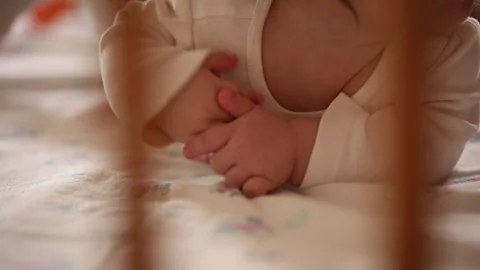 A baby  is playing 3 Stock Footage 320415814
