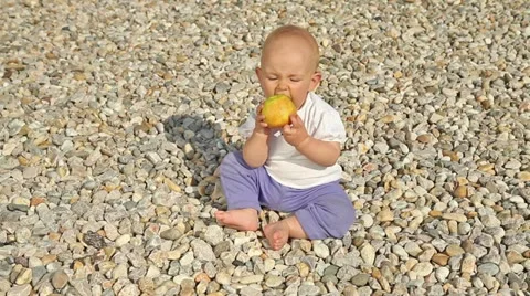 Baby playing with apple Stock Footage 18188391