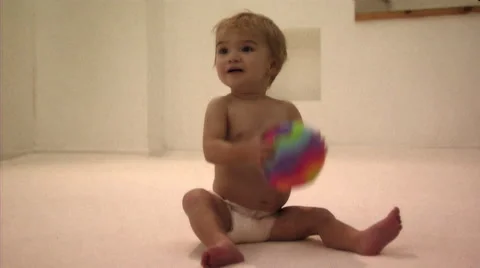 Baby playing with ball Stock Footage 43696351