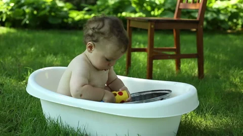 Baby playing in bath  Stock Footage 64937422