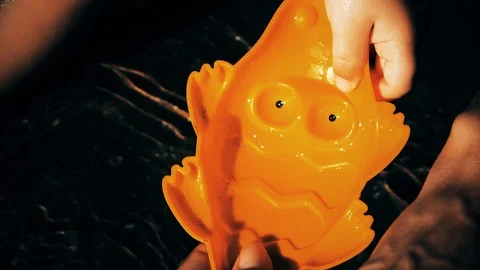 A baby playing on the beach Stock Footage 123385950